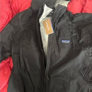 Patagonia Black Raincoat with Durable Synthetic Fabric